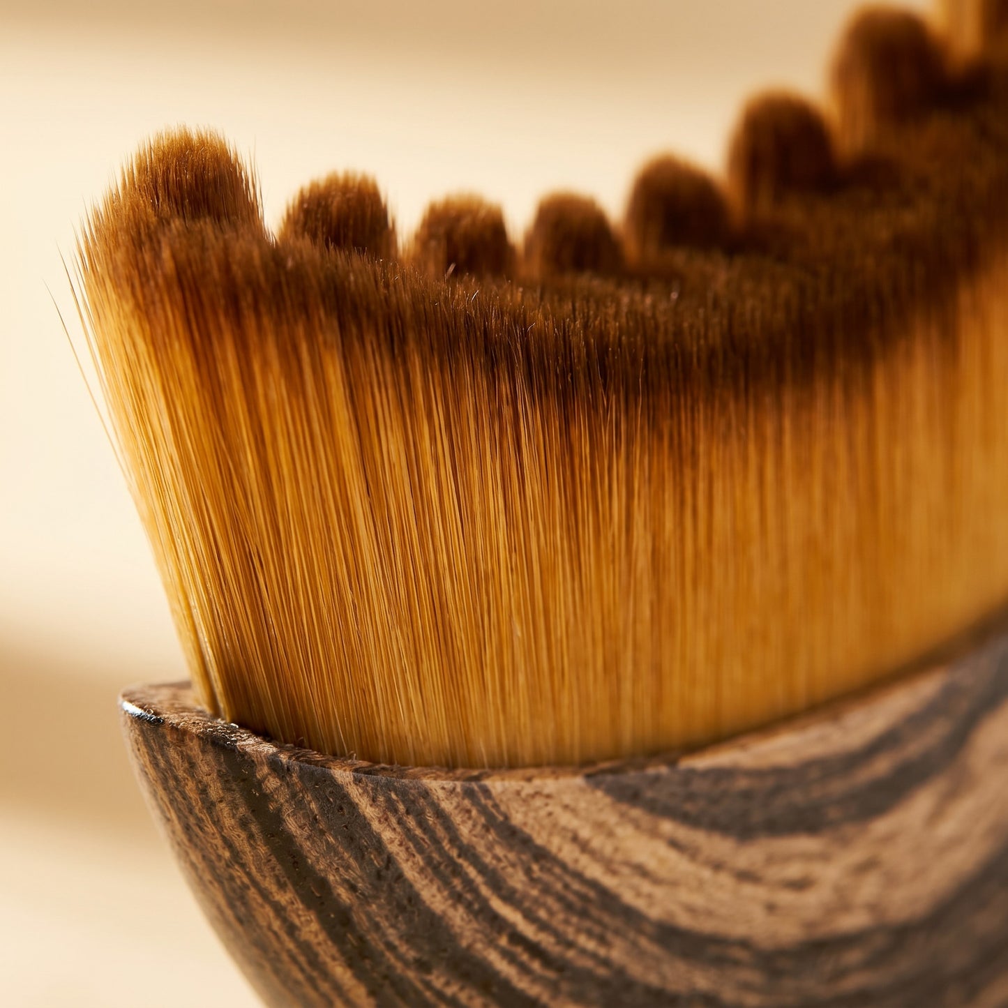 Close-up of ELARA brush soft golden bristles